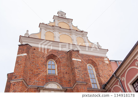 Historic building with winter snow at a city location during daytime Historic building with winter snow at a city location during daytime 134918178