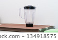 Natural light. black food processor. Near the nozzle for use. In the background is a kitchen for cooking. High quality photo 134918575