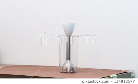 Natural light. black food processor. Near the nozzle for use. In the background is a kitchen for cooking. High quality photo 134918577