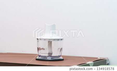 Natural light. black food processor. Near the nozzle for use. In the background is a kitchen for cooking. High quality photo 134918578