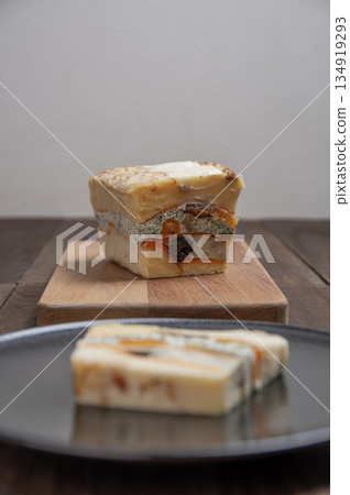 A rich cheese terrine made with luxurious dried fruits and nuts A rich cheese terrine made with luxurious dried fruits and nuts 134919293