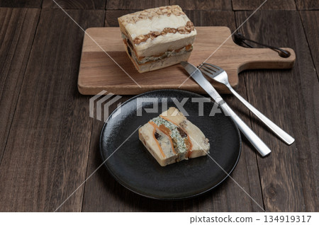 A rich cheese terrine made with luxurious dried fruits and nuts A rich cheese terrine made with luxurious dried fruits and nuts 134919317