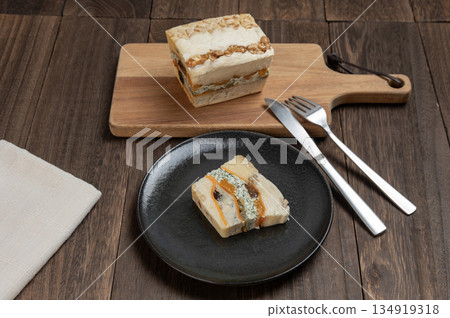 A rich cheese terrine made with luxurious dried fruits and nuts A rich cheese terrine made with luxurious dried fruits and nuts 134919318