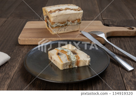 A rich cheese terrine made with luxurious dried fruits and nuts 134919320