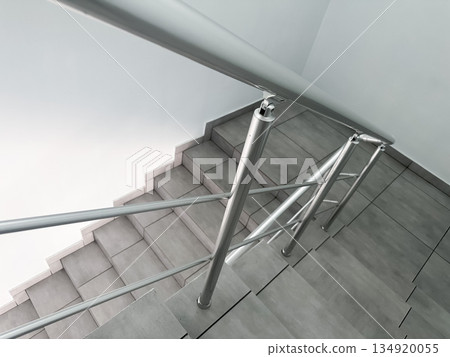 Modern metal staircase with clean lines and sleek design. 134920055