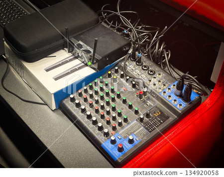 Professional audio mixer with various knobs and sliders. Professional audio mixer with various knobs and sliders. 134920058