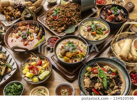 many different thai food dishes on table in modern restaurant in bangkok thailand 134920596