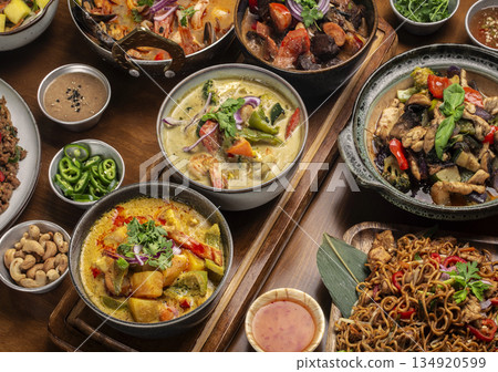 many different thai food dishes on table in modern restaurant in bangkok thailand 134920599