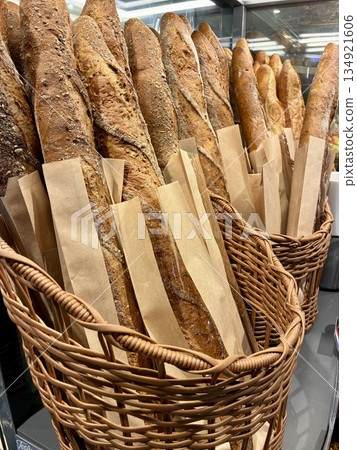 French bread lined up in a bakery French bread lined up in a bakery 134921606