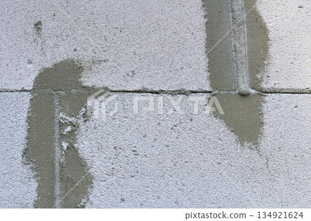 Construction seam.Joint between two concrete blocks, sealed with cement Construction seam.Joint between two concrete blocks, sealed with cement 134921624