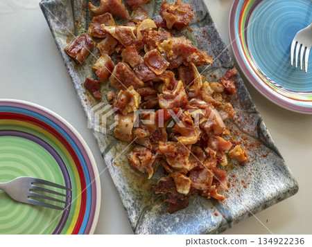 pork ear marinated and presented in a rectangular ceramic plate and two colorful serving plates pork ear marinated and presented in a rectangular ceramic plate and two colorful serving plates 134922236