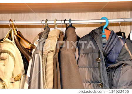 Hanger with outerwear. Hanger with outerwear. 134922496