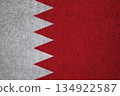 Flag of Bahrain on an ancient concrete surface. Concept of Bahraini heritage and patriotism.. 134922587