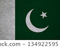 Flag of Pakistan on an ancient concrete surface. Concept of Pakistani heritage and patriotism.. 134922595
