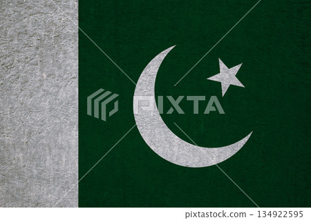 Flag of Pakistan on an ancient concrete surface. Concept of Pakistani heritage and patriotism.. 134922595