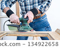 Carpenter at work, restoring an old wooden window. Carpentry. 134922658