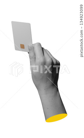 Close up of a bank card with smart chip in a human hand isolated on white.. 134923099