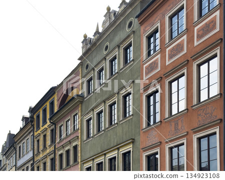 Colorful historic buildings in Warsaw Old Town with detailed facades, classic windows, and Colorful historic buildings in Warsaw Old Town with detailed facades, classic windows, and 134923108