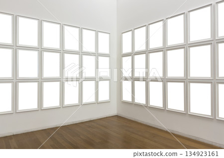 White art gallery interior with empty frames arranged on two walls. Minimalist mockup exhibition 134923161