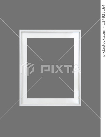 Minimalist empty white picture frame isolated on grey background. Blank vertical photo or artwork Minimalist empty white picture frame isolated on grey background. Blank vertical photo or artwork 134923164