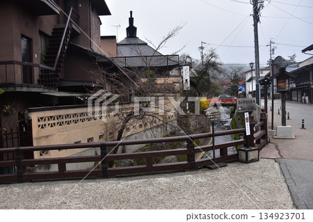 Old townscape of Takayama City, Gifu Prefecture, Japan. Old houses exuding a sense of history. Morning scene during the Takayama Spring Festival. A stream running through the city. Old townscape of Takayama City, Gifu Prefecture, Japan. Old houses exuding a sense of history. Morning scene during the Takayama Spring Festival. A stream running through the city. 134923701