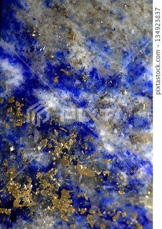 Close up of lapis lazuli blue and gold crystal gemstone harmony background Close up of lapis lazuli blue and gold crystal gemstone harmony background 134923837
