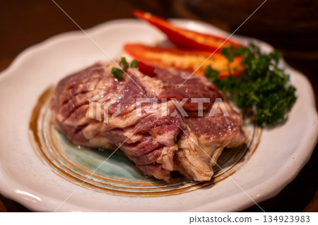 Raw marinated pork collar on the plate Raw marinated pork collar on the plate 134923983