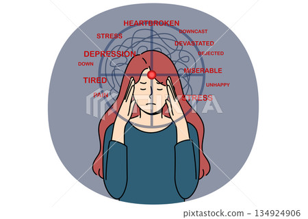 Depressed woman experiencing stress and suffering, clutching head with target from gun 134924906