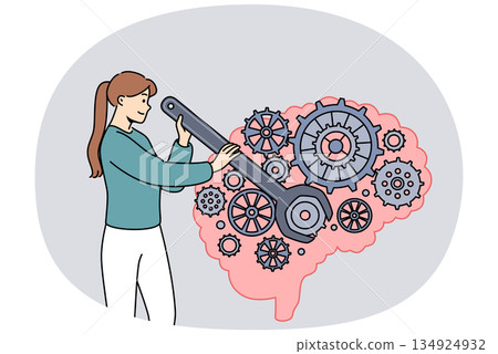 Woman is developing brain and improving intelligence by turning gears with wrench 134924932