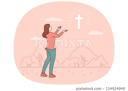 Catholic woman looks at cross glowing in sky, praying to god for help in finding right path Catholic woman looks at cross glowing in sky, praying to god for help in finding right path 134924948