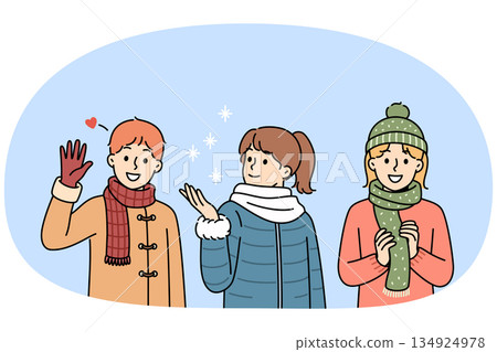 Little kids in winter clothes stand under falling snow, rejoicing at onset of christmas weekend Little kids in winter clothes stand under falling snow, rejoicing at onset of christmas weekend 134924978