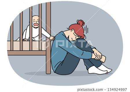 Exhausted mother with postpartum stress sits on floor near crib with crying newborn Exhausted mother with postpartum stress sits on floor near crib with crying newborn 134924997
