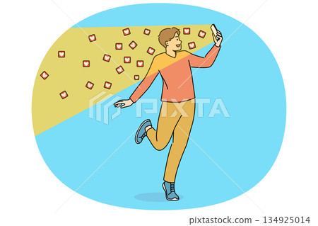 Man reads messages on social network on phone with declaration of love, standing among flying hearts 134925014