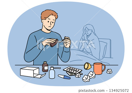 Man helps woman recover by pouring medicinal syrup, standing near bed with sick wife 134925072