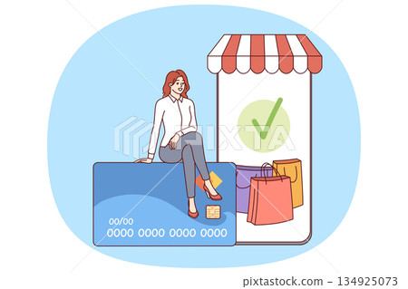Phone for mobile shopping and woman shopper sitting on credit card to pay for online purchases Phone for mobile shopping and woman shopper sitting on credit card to pay for online purchases 134925073