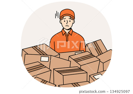 Sad man courier stands among scattered cardboard boxes, suffering from overload. 134925097