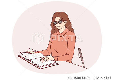 Blind woman reads braille book, using literature for people with disabilities to gain new knowledge 134925151