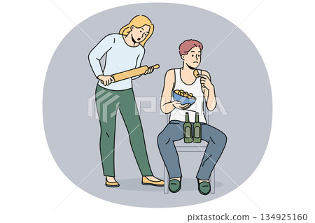 Woman quarrels with slacker husband, who drinks beer and eats chips and does not want to go to job Woman quarrels with slacker husband, who drinks beer and eats chips and does not want to go to job 134925160