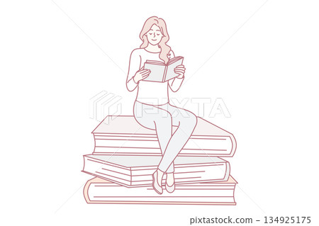 Happy woman sit on pile reading book 134925175
