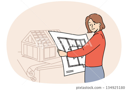 Woman architect creates engineering plans and models of houses, working in construction office 134925180