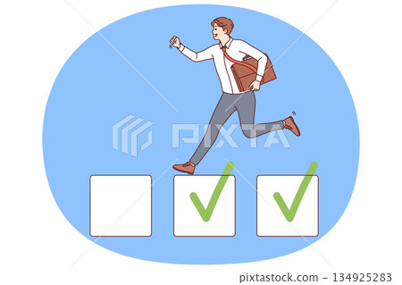 Business man is engaged in task management and marking already completed projects 134925283