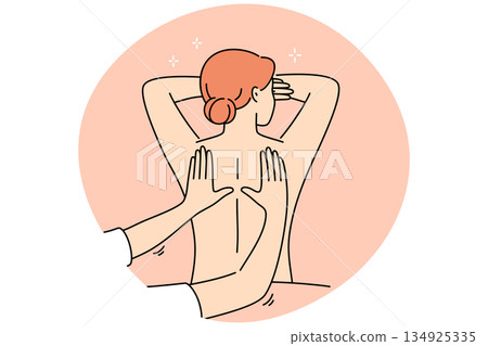 Woman attends massage treatments in SPA salon lying with bare back and enjoying rejuvenation therapy 134925335