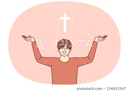 Man with christian cross above head rejoices at light coming from heaven and calls to pray Man with christian cross above head rejoices at light coming from heaven and calls to pray 134925347