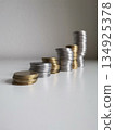 Coins towers composition on white background 134925378