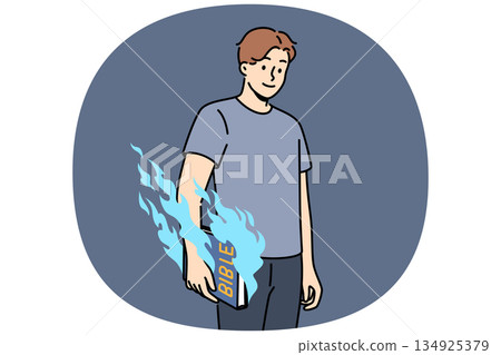 Man holds bible and feels magical energy emanating from religious book with old testament or prayers 134925379