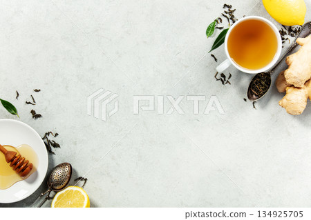 Herbal Tea with Ginger, Lemon, and Honey on Light Background 134925705