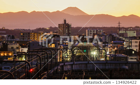 Mount Fuji, Odakyu Railway tracks, and a train seen from Seijo's Fudobashi Bridge, one of the 100 best views of Mount Fuji in the Kanto region Mount Fuji, Odakyu Railway tracks, and a train seen from Seijo's Fudobashi Bridge, one of the 100 best views of Mount Fuji in the Kanto region 134926422