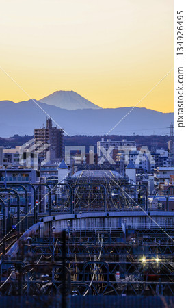 Mount Fuji, Odakyu Railway tracks, and a train seen from Seijo's Fudobashi Bridge, one of the 100 best views of Mount Fuji in the Kanto region 134926495
