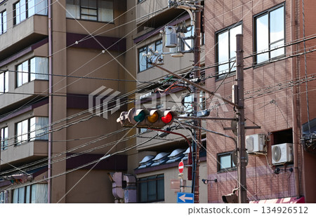 Close-up of the traffic light in Kyoto, Japan with streetscape. Transportation signal.  134926512