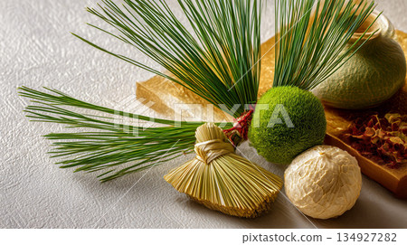 A display of natural materials including pine needles, moss balls, and straw brooms. A display of natural materials including pine needles, moss balls, and straw brooms. 134927282